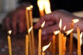 Old man lights a candle Royalty Free Stock Photo