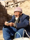 Old man from loess plateau selling jujube