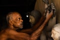 Old man making durga pratima or durga idol worshiped all over the west bengal and also all over the india in autumn season Royalty Free Stock Photo