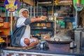 Old man making masala doodh in his shop in Nathdwara, India. Royalty Free Stock Photo