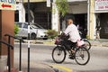 Old man malaysian people biking bicycle on road at George Town