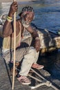 Fisherman waiting on gangplank in Caribbean