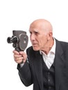 Old man with old video camera. Royalty Free Stock Photo