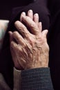 Old man and old woman holding hands Royalty Free Stock Photo