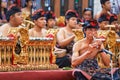 Old man play ethnic Balinese music on bamboo flute