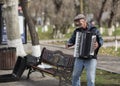 Old man is playing on the accordion on the streets of Yerevan. Armenia.