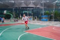 The old man is playing basketball as a leisure sport