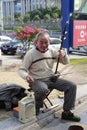 old man playing an erhu