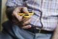 Old man playing with a fidget spinner Royalty Free Stock Photo