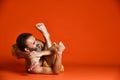 Studio shot of senior bearded man doing yoga poses and stretching his legs shirtless Royalty Free Stock Photo