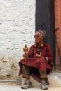 The old man with the prayer wheel