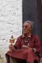 The old man with the prayer wheel