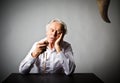 Old man is praying with rosary beads. Prayer and temptation. Royalty Free Stock Photo