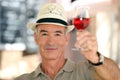 Old man raising a glass Royalty Free Stock Photo