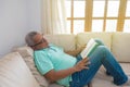 Old man reading a book at home Royalty Free Stock Photo