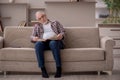 Old man reading book at home Royalty Free Stock Photo