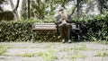 Old man reading book in the park Royalty Free Stock Photo