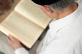 An old man reading a book. Selective focus Royalty Free Stock Photo