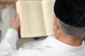 An old man reading a book. Selective focus Royalty Free Stock Photo