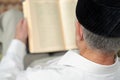 An old man reading the book. Selective focus Royalty Free Stock Photo