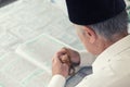 An old man reading the Koran Royalty Free Stock Photo