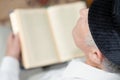 An old man reading the Koran. Selective focus Royalty Free Stock Photo