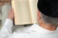 An old man reading the Koran. Selective focus Royalty Free Stock Photo