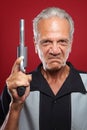 Old Man with a Revolver Royalty Free Stock Photo