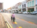 Old Man Riding a Bicycle Alone on The Street Singapore