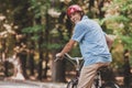 Old Man Riding on Bicycle in Park in Summer . Royalty Free Stock Photo