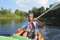 The old man rowing a kayak on the river Royalty Free Stock Photo
