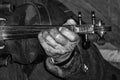 Old man's hand and violin Royalty Free Stock Photo