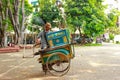 An old man selling Rangi cakes