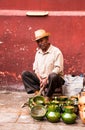 Old man selling typical handicraft pottery in a market in Oaxaca