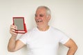 Old man senior face closeup missing tooth smile proper tooth care white t shirt visit dentist Royalty Free Stock Photo