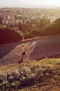 Old man senior jogging sport activity at sunset in Cagliari Sardinia - Italy Saint Michele Hill Monte San Michele