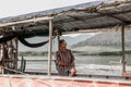 The old man Sitting on a boat