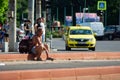 Old man sitting in the middle of the street Royalty Free Stock Photo