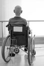 Old man sitting on wheelchair in hospital Royalty Free Stock Photo