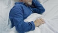 Old man sleeping in bed in the morning, recovery time and healthy sleep Royalty Free Stock Photo