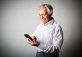 Old man and smart phone. Royalty Free Stock Photo