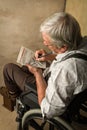Old man solving crossword puzzle Royalty Free Stock Photo