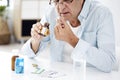 Old man taking pills Royalty Free Stock Photo