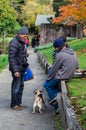 Old man talking with dog owners