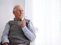 Old man, thinking and lonely for depression on couch, glasses and remember memories or mistake. Senior male person Royalty Free Stock Photo