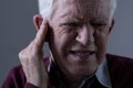 Old man with tinnitus Royalty Free Stock Photo