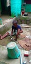 A old man trying to repair his won hand pump for fresh ground water for regular and general use in navkarhi madhubani bihar india