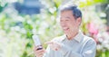 Old man use smart phone Royalty Free Stock Photo