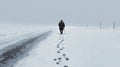 Old man walking alone leaving footprints in winter snow Royalty Free Stock Photo