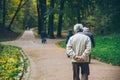 Old man walking by autumn park Royalty Free Stock Photo